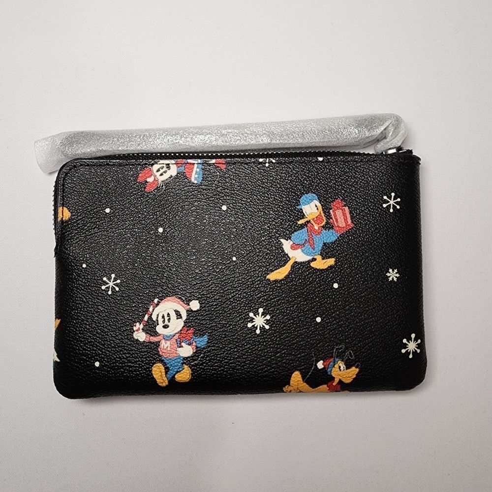 NWT Coach CN031 Disney Corner Zip Wristlet Holiday Minnie Mickey Daffy Pluto - Picture 2 of 3
